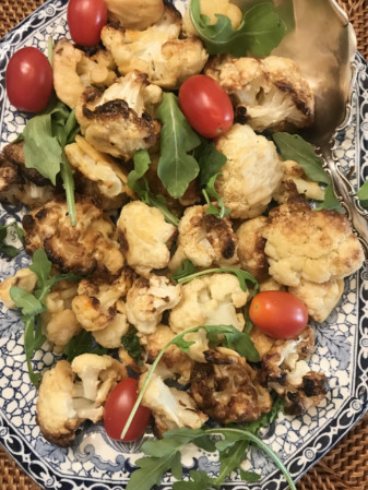 Crispy Cauliflower on a bed of tomatoes and lettuce